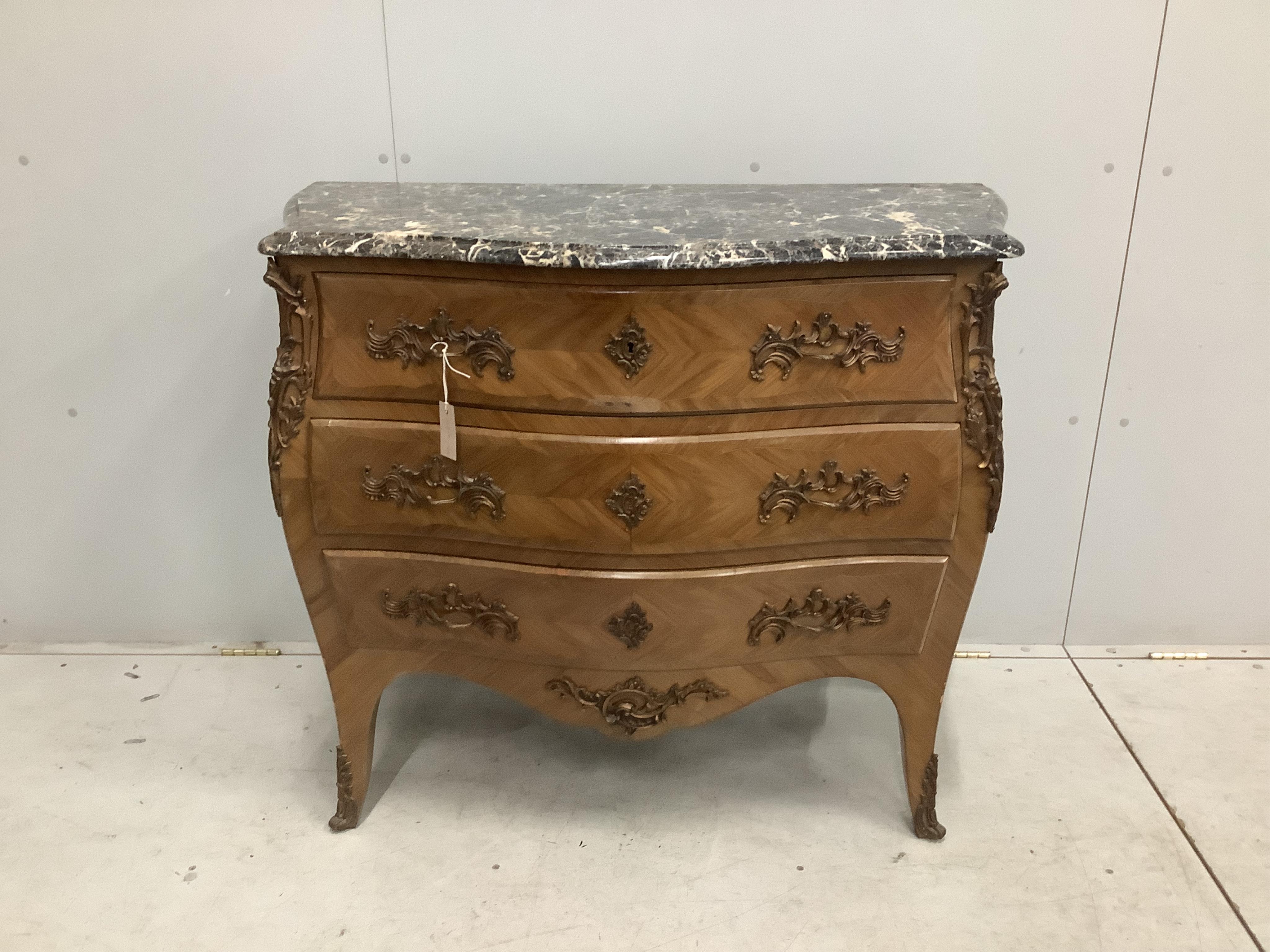 A Louis XV style gilt metal mounted marble top bombe commode, width 105cm, depth 49cm, height 89cm. Condition - fair